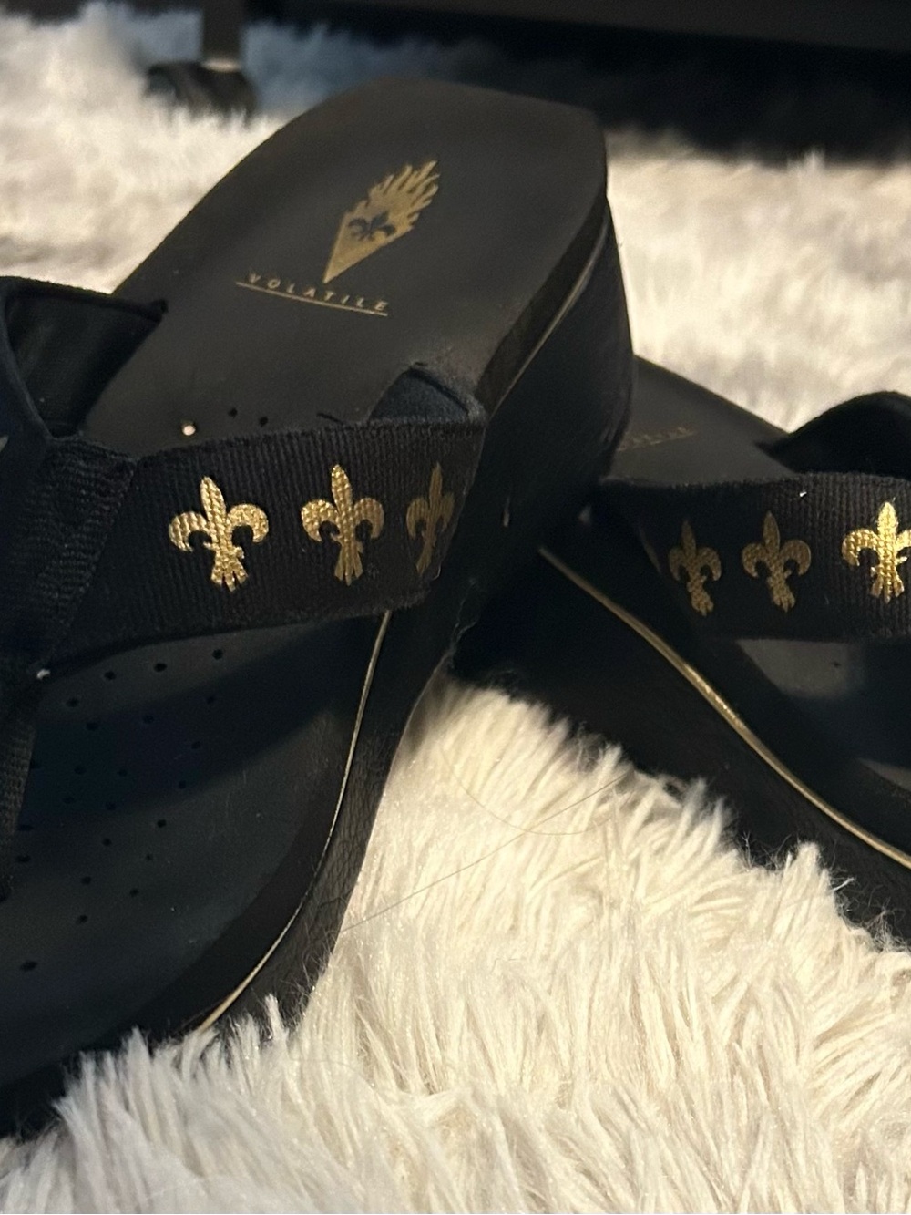 Volatile Black and Gold Platform Flip Flops with Fleur-de-Lis